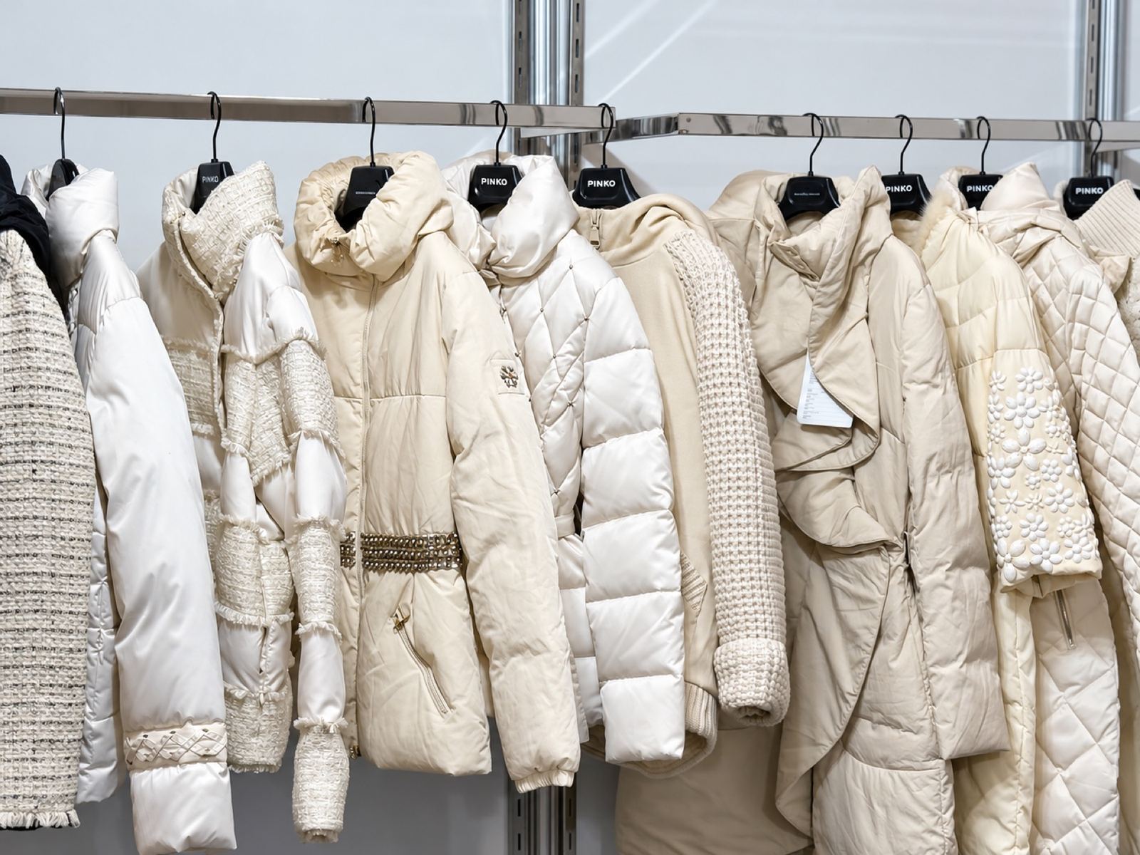 Winter coats in cream on the rail