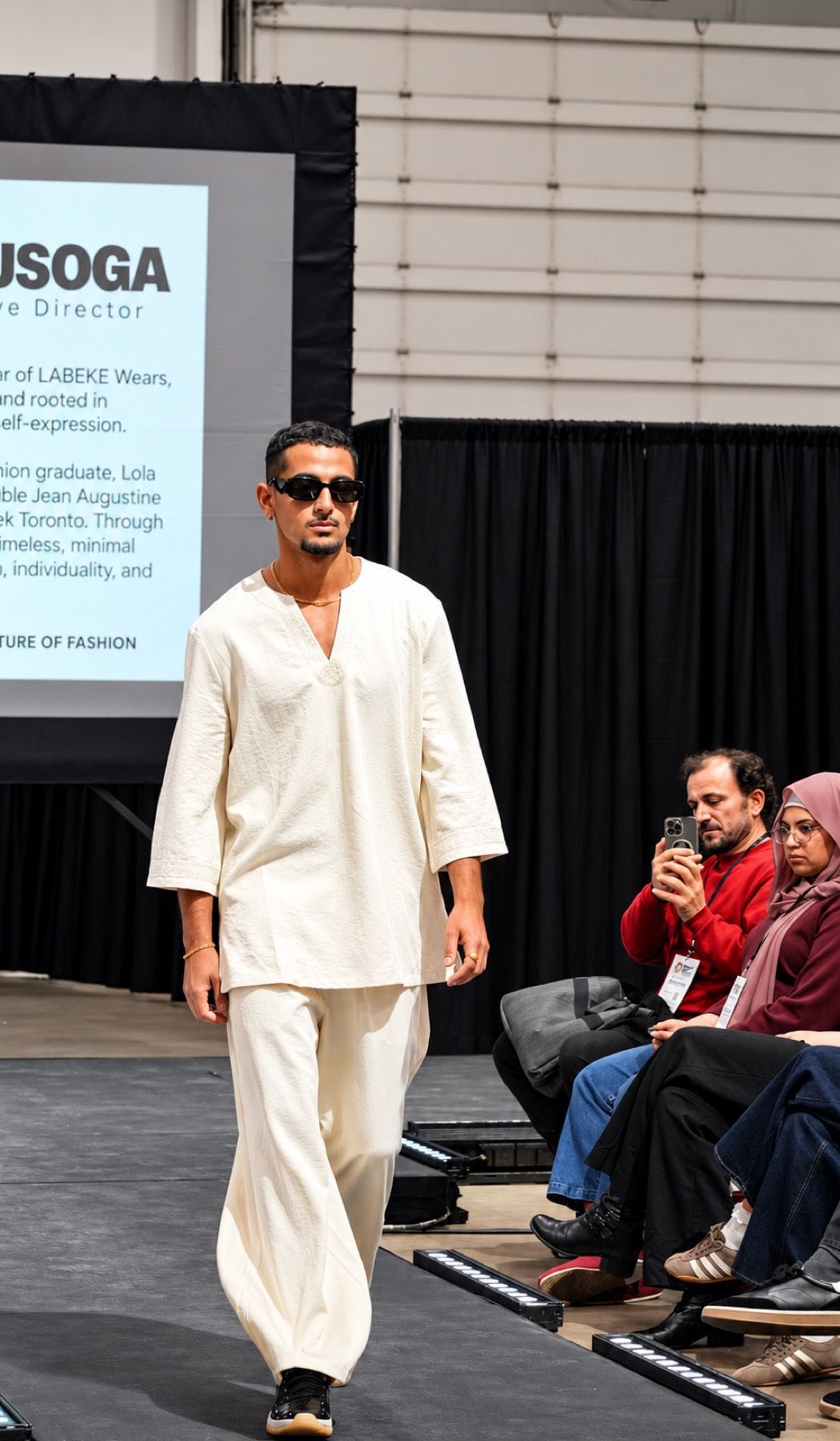 A model in ivory walking the ATS runway